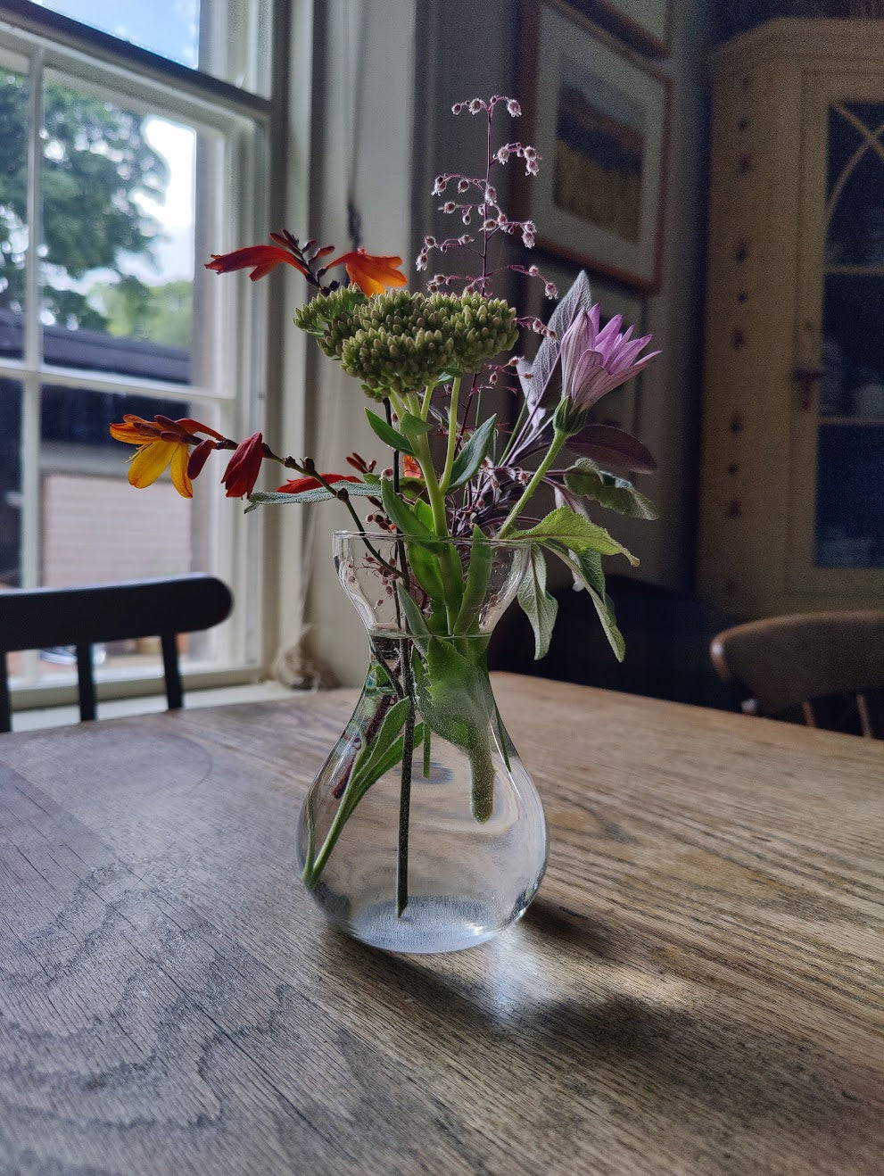 bunch of wildflowers on a kitchen table