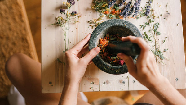 Herbal wellness ingredients with mortar and pestle