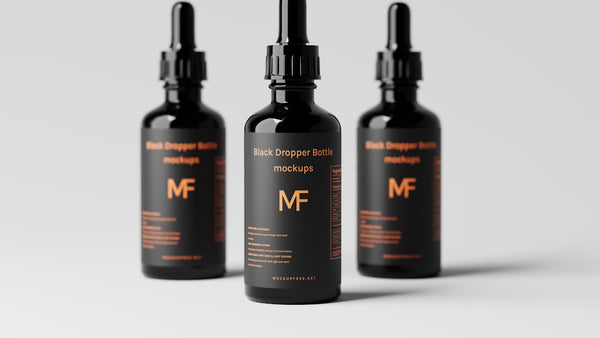 Dark glass dropper bottle on natural surface