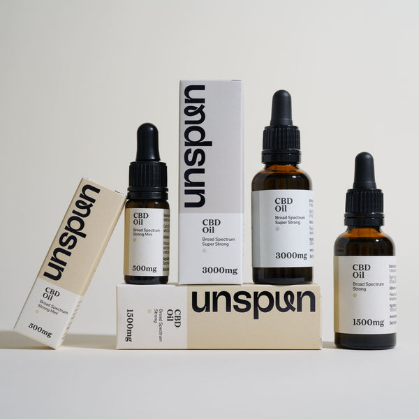 unspun's 3 CBD oil strengths, 500mg, 1500mg and 3000mg, with branded boxes