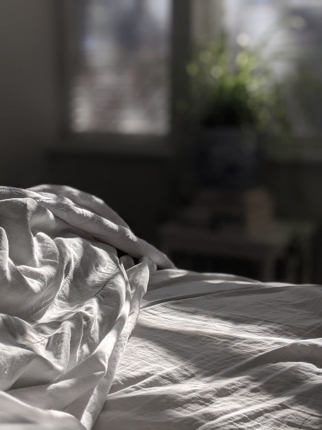 A soft, unmade bed