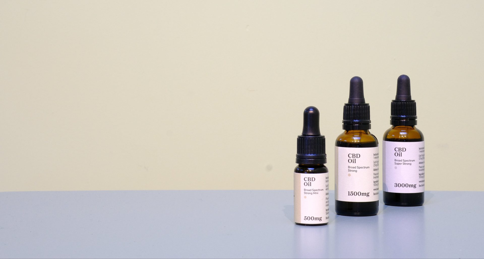 Three Unspun CBD oil bottles with varying strengths