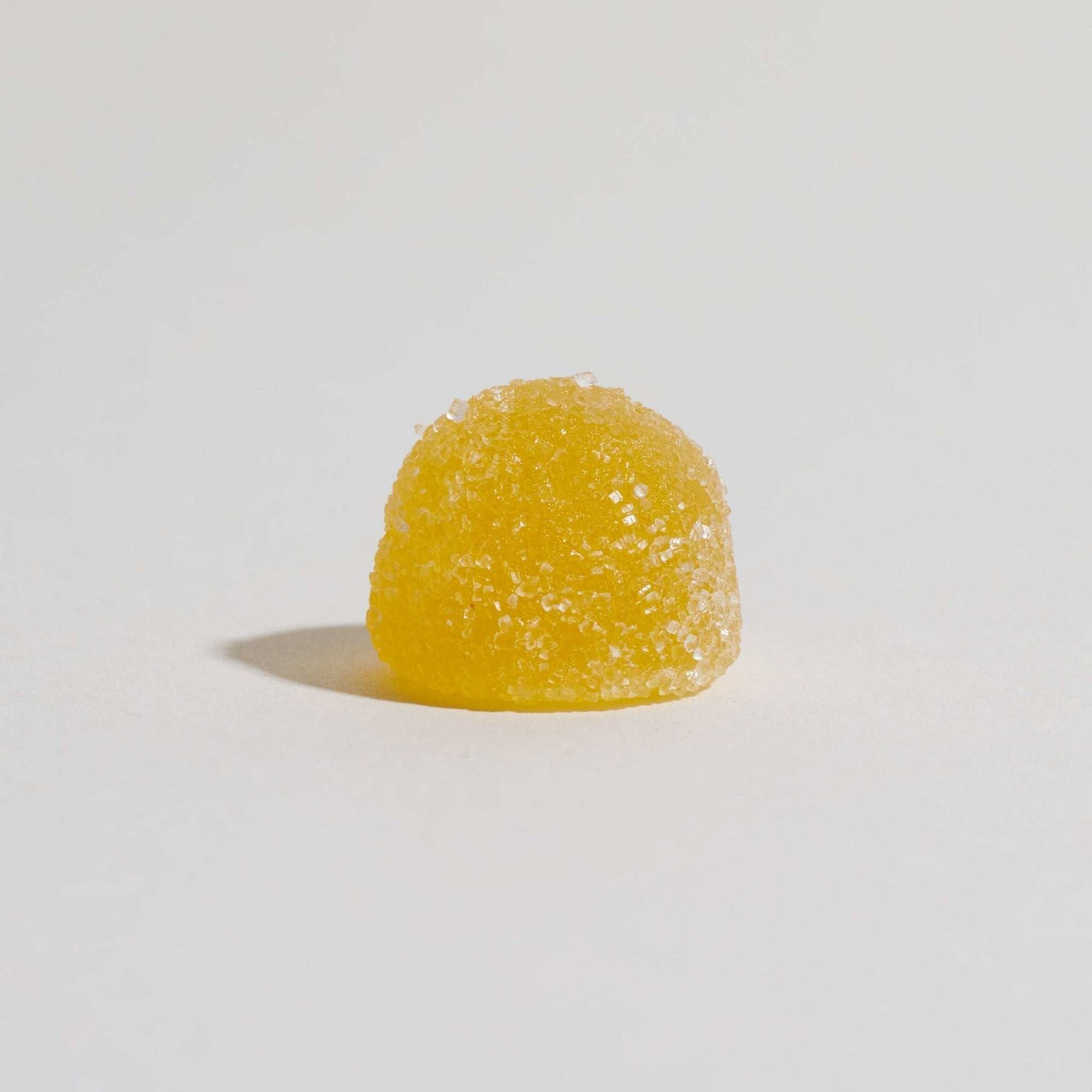 Unspun Broad Spectrum CBD Gummies  - A single yellow gummy